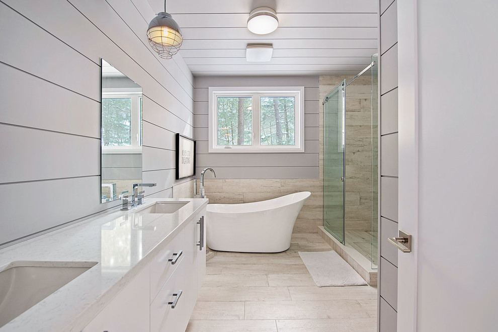 Country bathroom in Toronto with flat-panel cabinets, white cabinets, a freestanding tub, a corner shower, beige tile, grey walls, an undermount sink, beige floor, an open shower and beige benchtops.