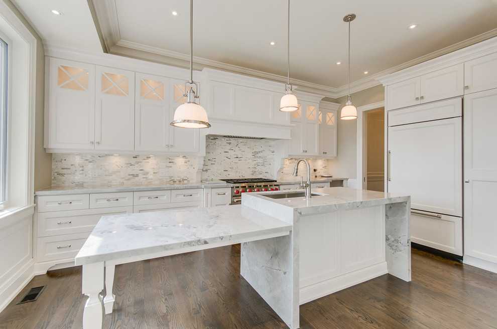 Photo of a large transitional l-shaped eat-in kitchen in Toronto with a single-bowl sink, flat-panel cabinets, white cabinets, wood benchtops, white splashback, mosaic tile splashback, dark hardwood floors and with island.