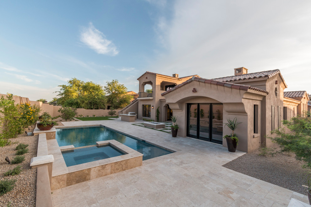 Example of a huge transitional beige two-story stucco house exterior design in Phoenix with a tile roof