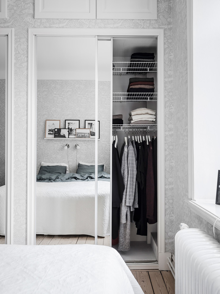 This is an example of a small scandinavian men's storage and wardrobe in Gothenburg.