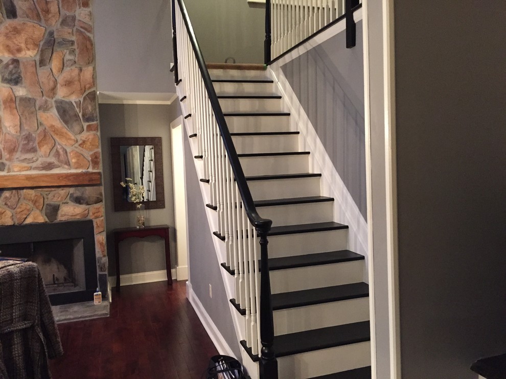 Small traditional wood straight staircase in New York with painted wood risers.