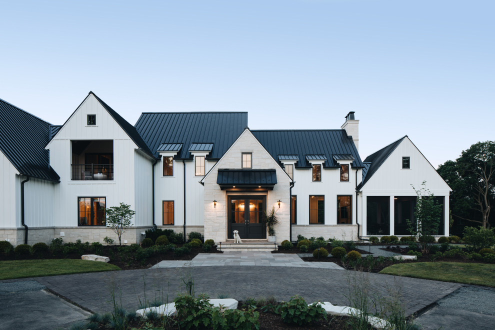 Inspiration for a large and white traditional detached house in Chicago with a black roof.