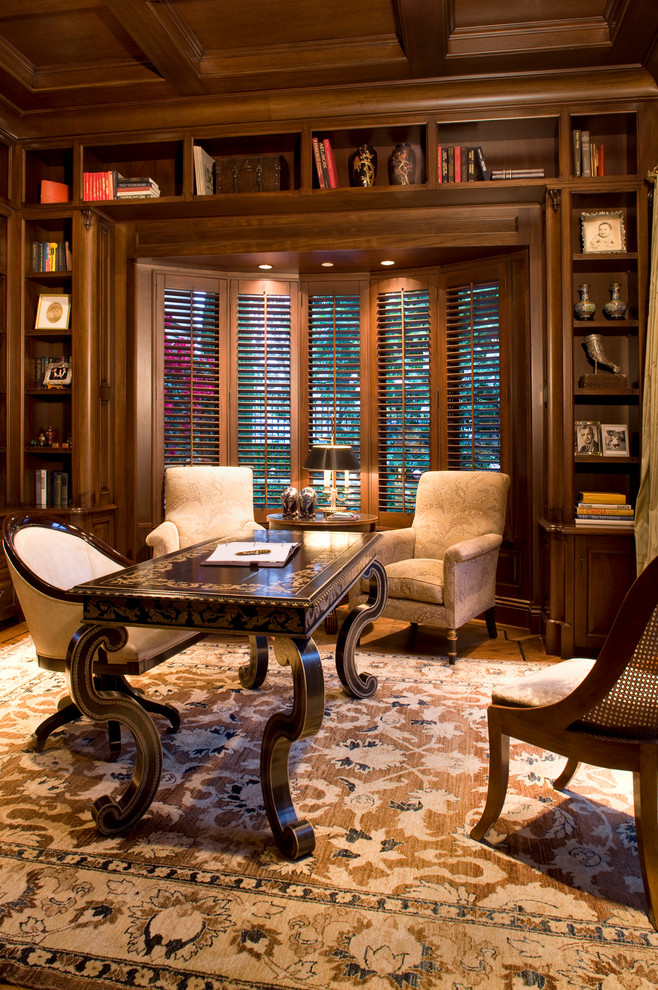 Photo of a traditional home office in Orange County with medium hardwood floors and a freestanding desk.
