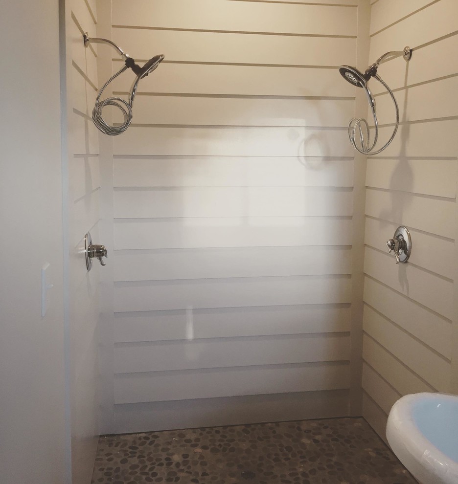 Example of a farmhouse gray tile and pebble tile light wood floor bathroom design in Atlanta with a vessel sink, shaker cabinets, gray cabinets, wood countertops, a two-piece toilet and white walls