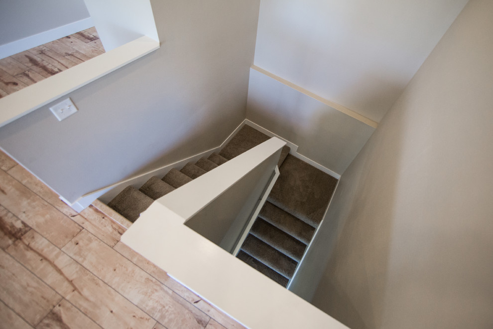 Inspiration for a transitional staircase remodel in Cedar Rapids