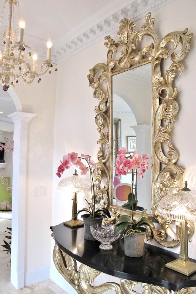 Photo of a mid-sized traditional hallway in Chicago with white walls and limestone floors.