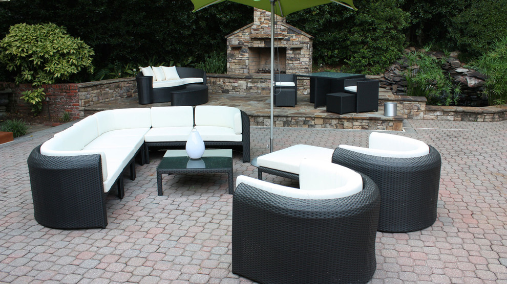 Design ideas for a large modern backyard patio in Atlanta with a fire feature, brick pavers and no cover.