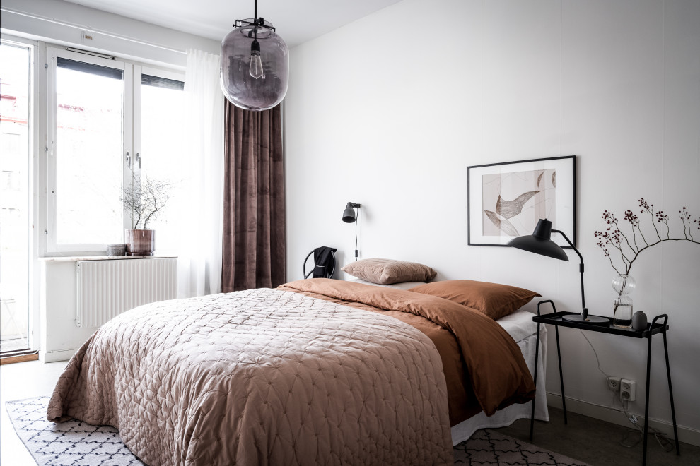 Inspiration for a scandinavian bedroom in Gothenburg with white walls and no fireplace.