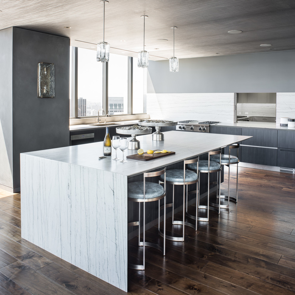 Inspiration for a mid-sized transitional l-shaped dark wood floor eat-in kitchen remodel in San Francisco with a single-bowl sink, medium tone wood cabinets, marble countertops, stone slab backsplash and an island