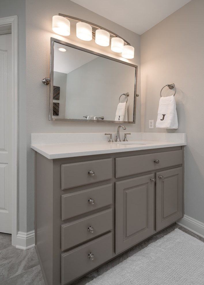 Double shower - large transitional master multicolored tile and mosaic tile porcelain tile double shower idea with gray walls, an undermount sink and quartz countertops