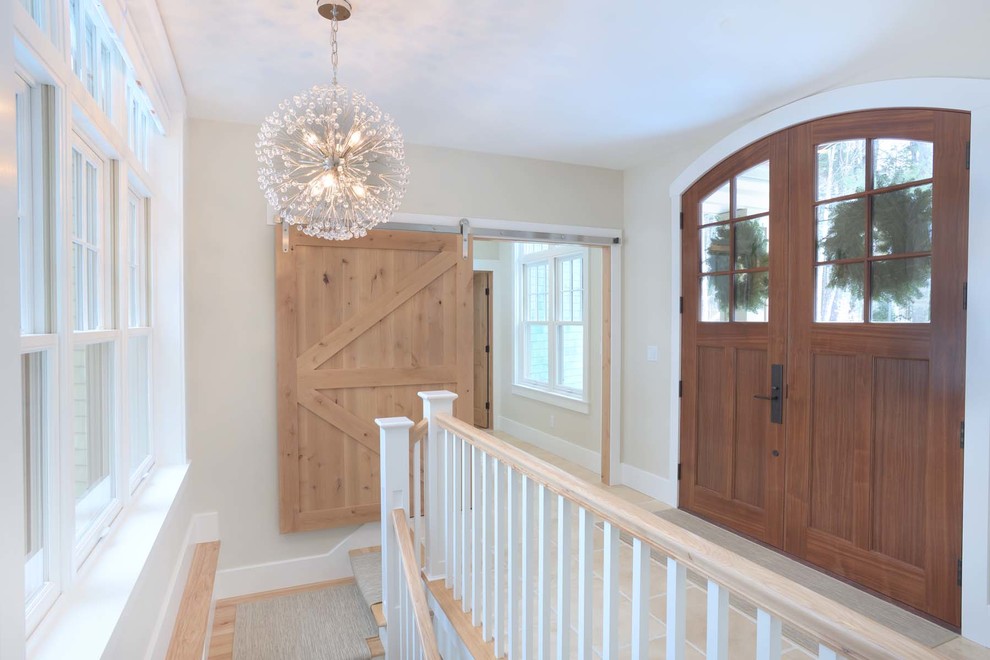 Inspiration for a transitional foyer remodel with a dark wood front door