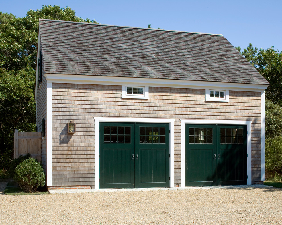 This is an example of a mid-sized beach style detached two-car garage in Boston.