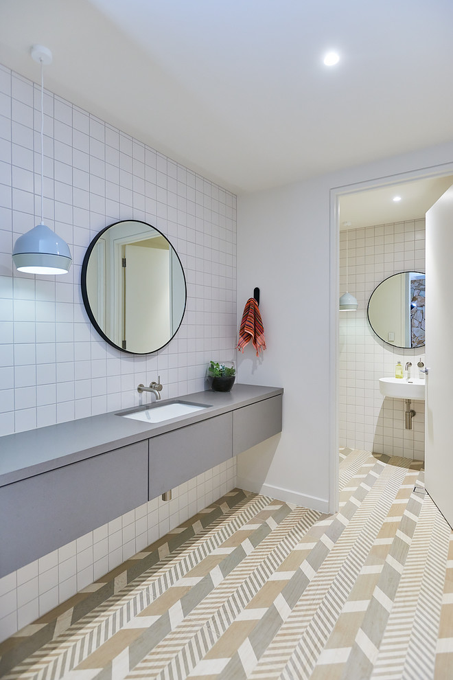 This is an example of a large eclectic 3/4 bathroom in Adelaide with furniture-like cabinets, light wood cabinets, a freestanding tub, white tile, ceramic tile, white walls, ceramic floors and engineered quartz benchtops.