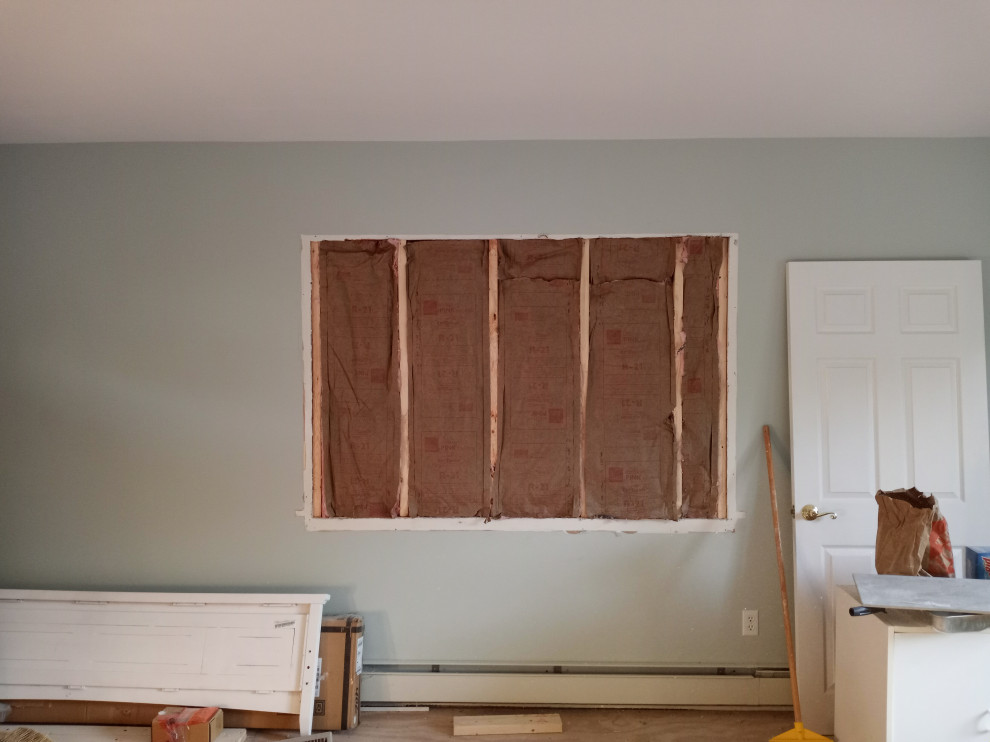 Master bedroom window removed, framed and Insulated.