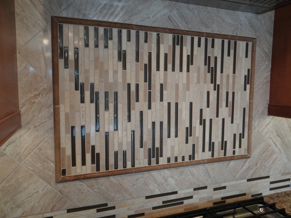 Transitional kitchen photo in Tampa with beige backsplash, ceramic backsplash and an island