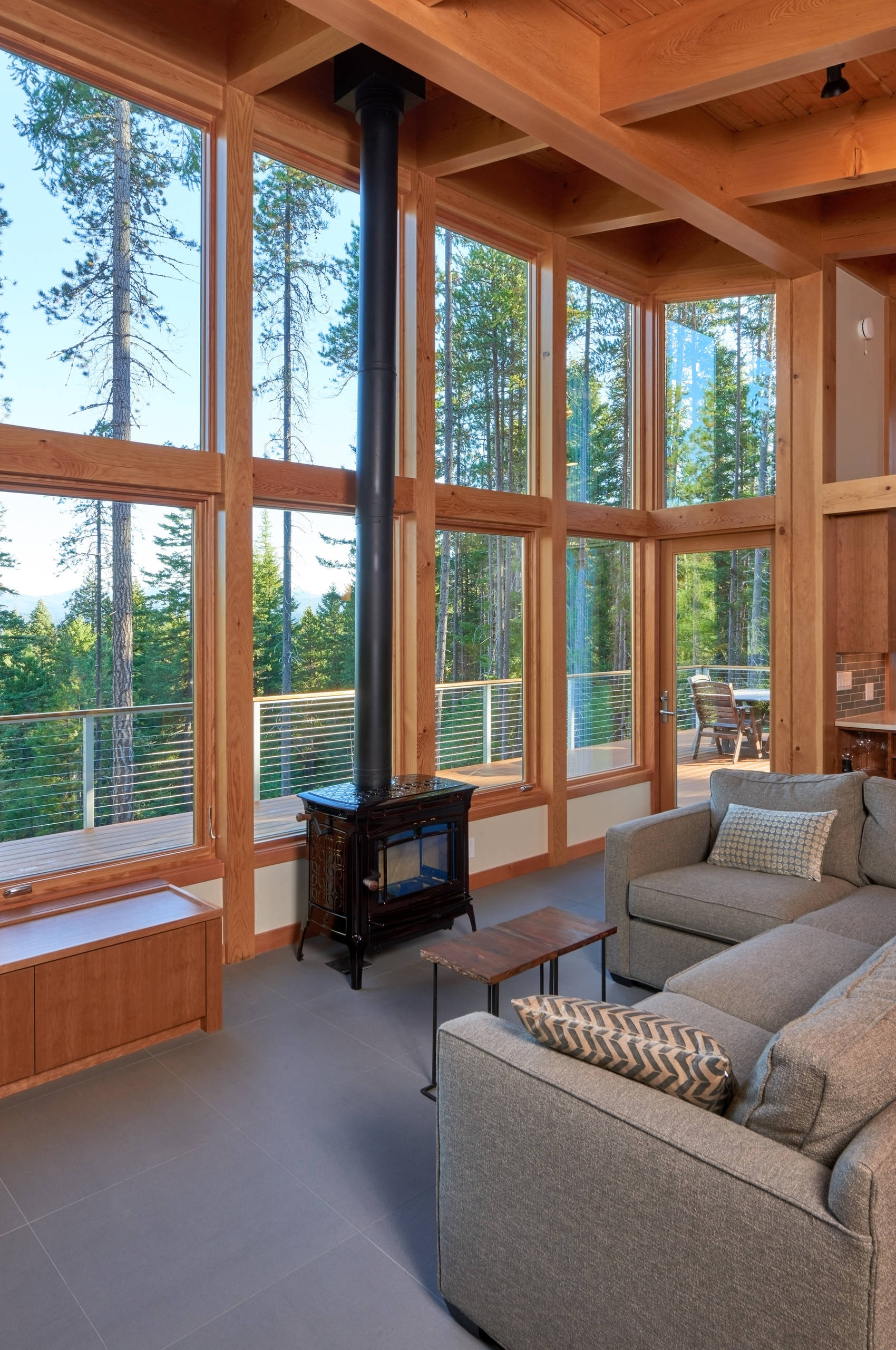 Another view of living room and wood stove.