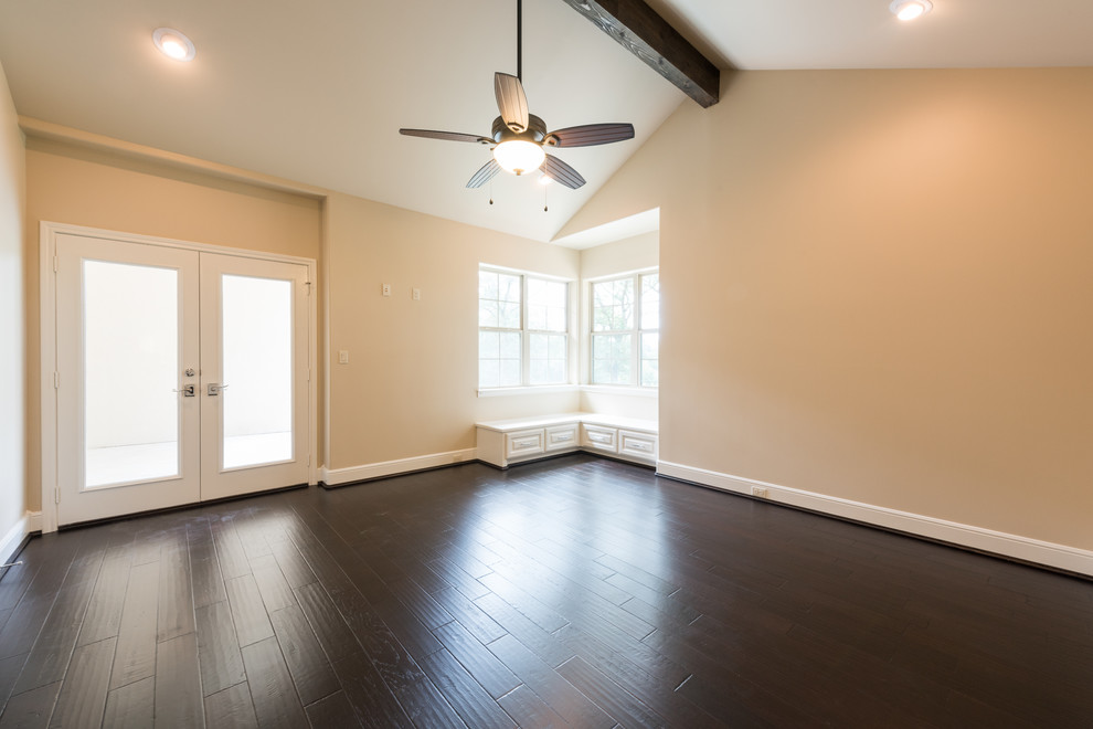 This is an example of an expansive transitional sunroom in Houston with dark hardwood floors, no fireplace, a standard ceiling and brown floor.