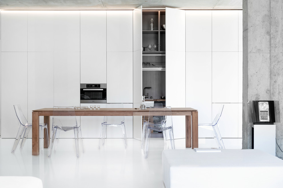 Photo of a contemporary open plan dining in Moscow with white walls.