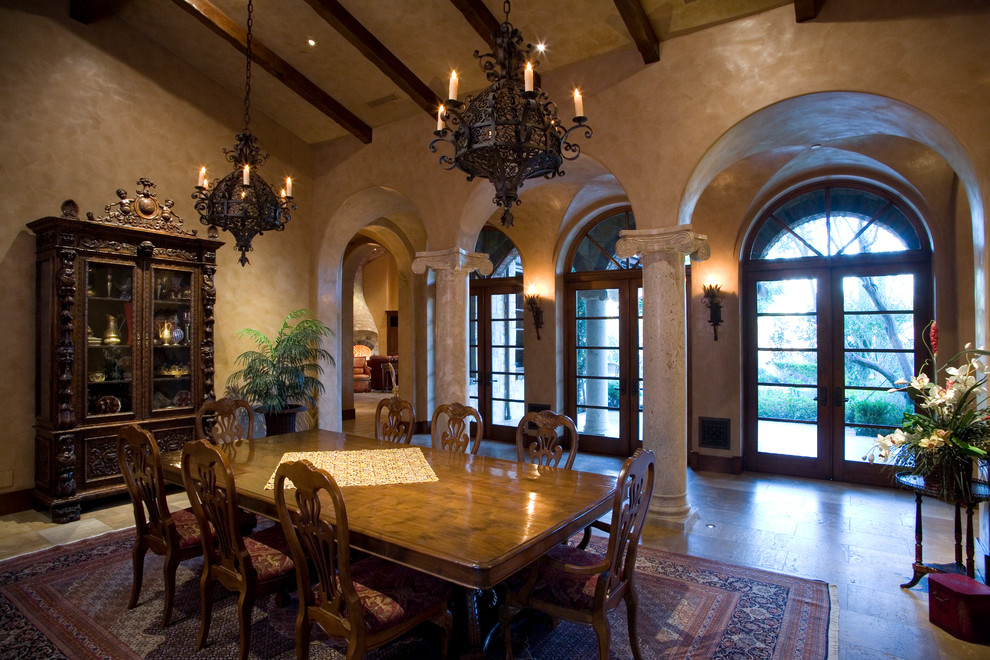 Design ideas for a mediterranean dining room in Orange County with beige walls.