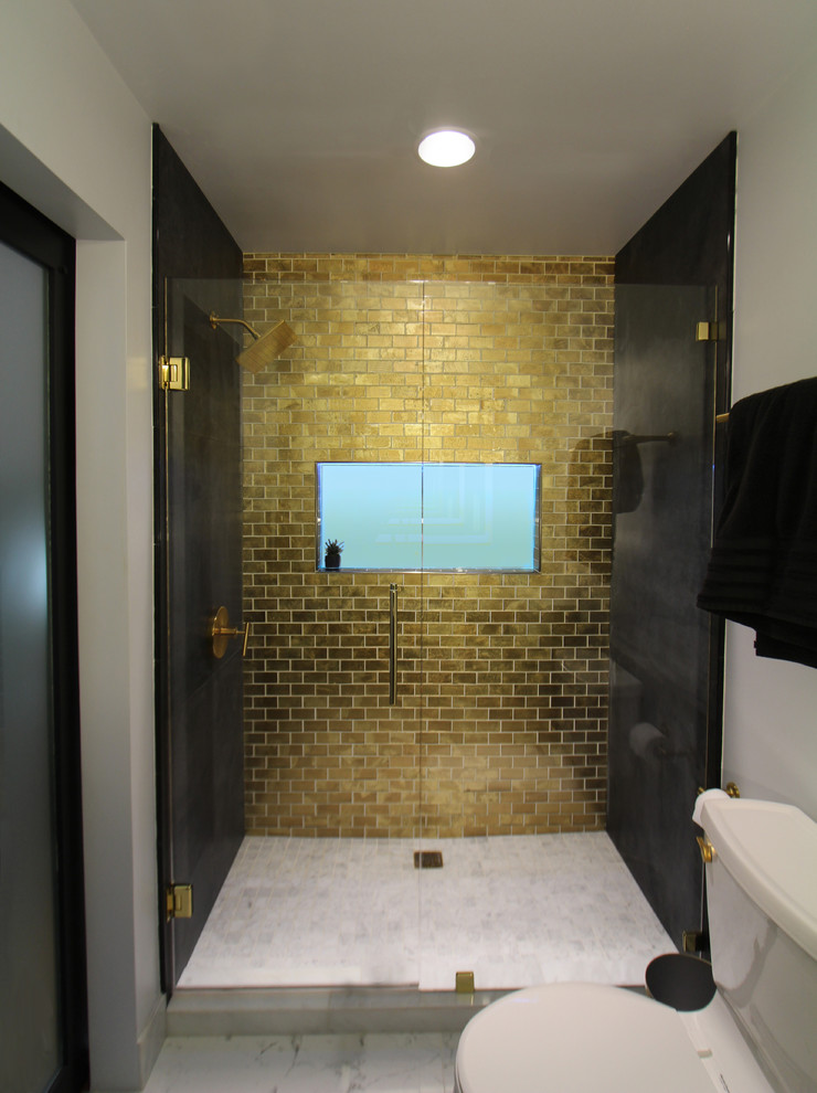 Bathroom - mid-sized contemporary 3/4 black tile and porcelain tile porcelain tile and white floor bathroom idea in Atlanta with shaker cabinets, black cabinets, a two-piece toilet, white walls, an undermount sink, marble countertops and a hinged shower door