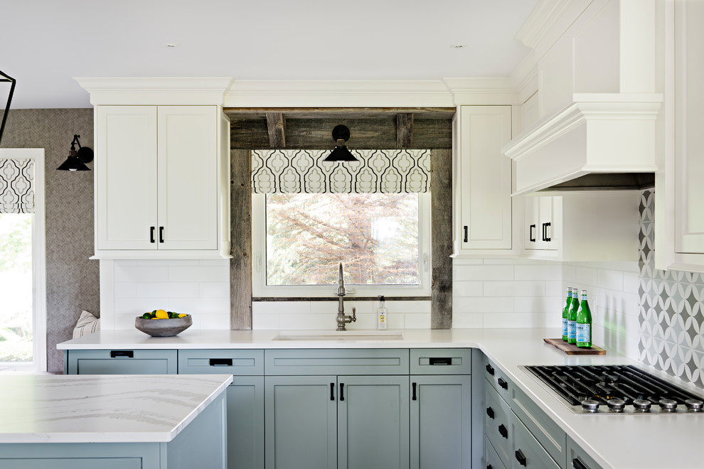 Mid-sized transitional porcelain tile and beige floor open concept kitchen photo in Toronto with a single-bowl sink, shaker cabinets, white cabinets, quartzite countertops, white backsplash, subway tile backsplash, stainless steel appliances, an island and white countertops