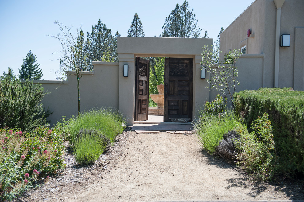 Mediterranean garden in Seattle with a garden path and gravel.