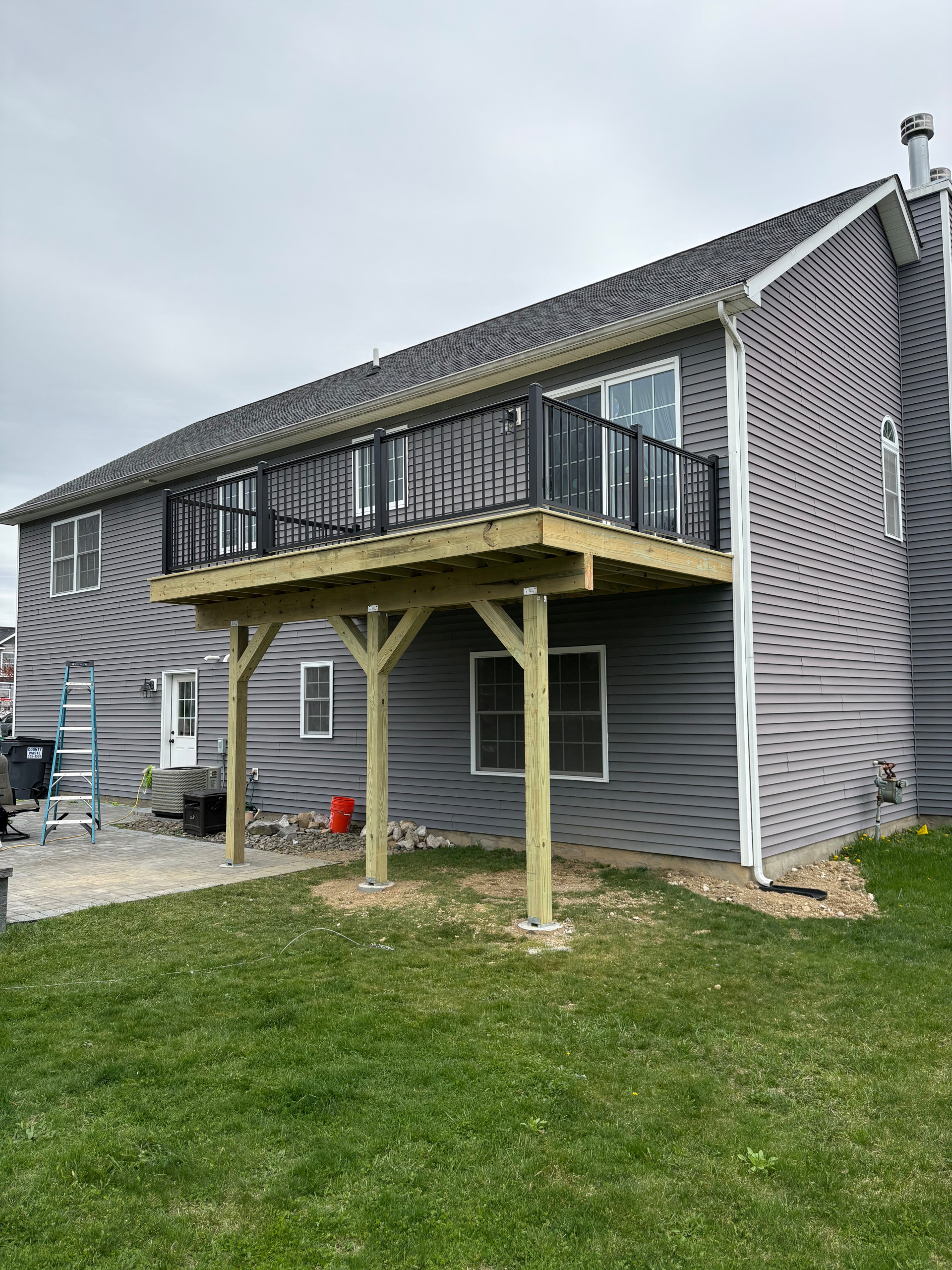 Pressure Treated Wood  Deck with black powder coated rail