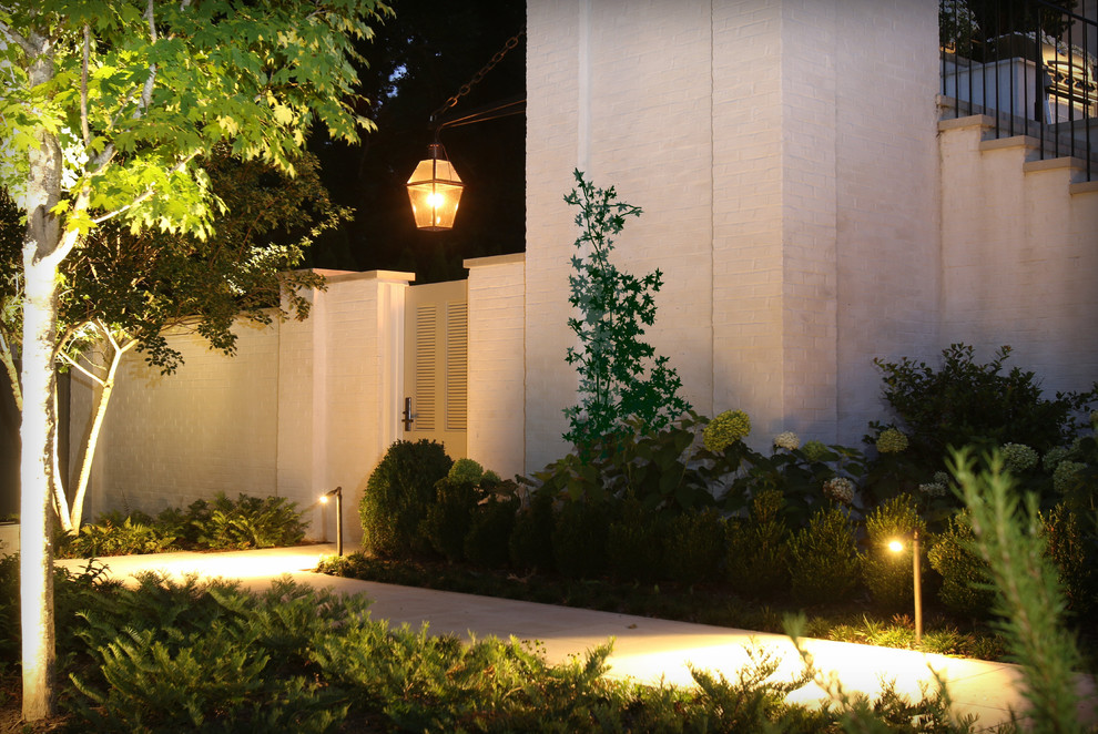 This is an example of a mid-sized transitional backyard stone landscaping in Nashville.