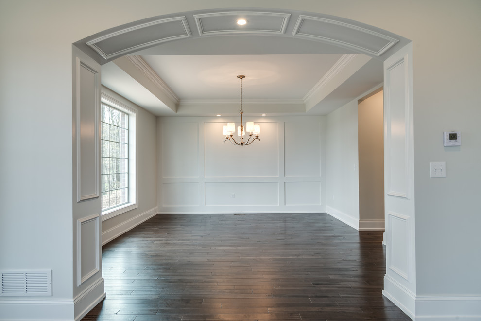 Example of a large transitional dark wood floor and brown floor home design design with gray walls