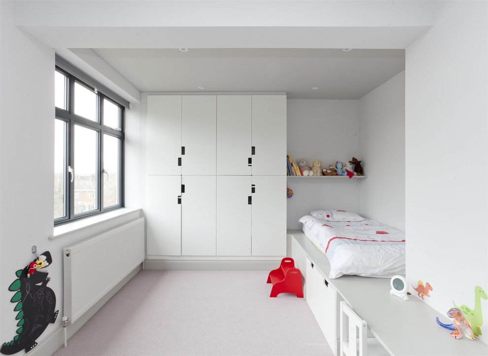 Design ideas for a modern gender-neutral kids' room in London with white walls and grey floor.