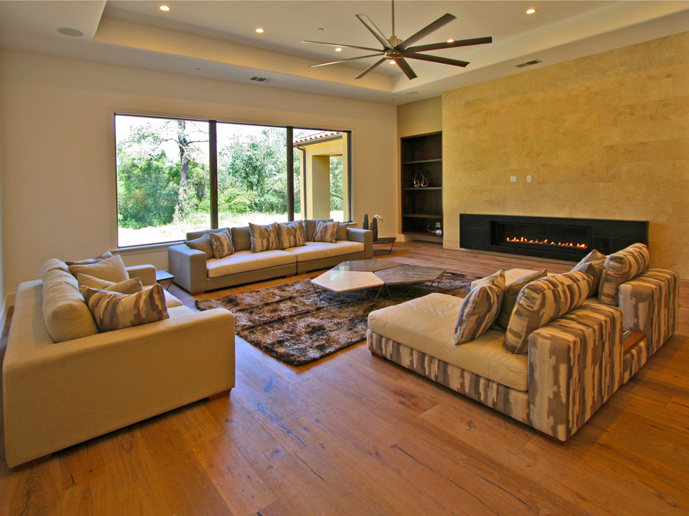 Design ideas for a large contemporary open concept living room in Sacramento with a ribbon fireplace.