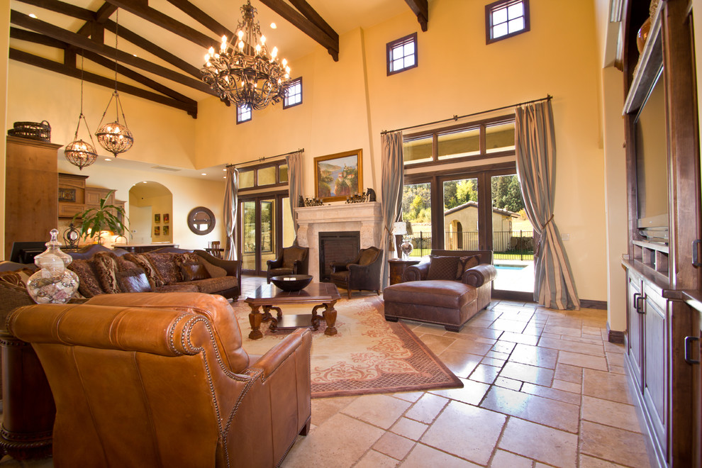 Photo of an arts and crafts open concept living room in Other with beige walls, travertine floors, a standard fireplace, a plaster fireplace surround and a built-in media wall.
