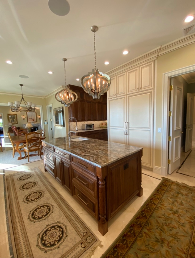 Complete remodel of kitchen after major water damage. Custom cabinets, Crema Marfil tile floors with inlay. Marble tile backsplash, granite and quartizite countertops.