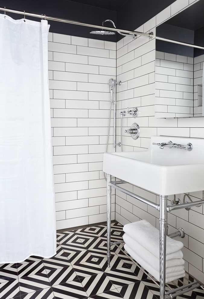 Photo of a transitional 3/4 bathroom in Nashville with an open shower, black and white tile, white tile, subway tile, a console sink, multi-coloured floor and a shower curtain.