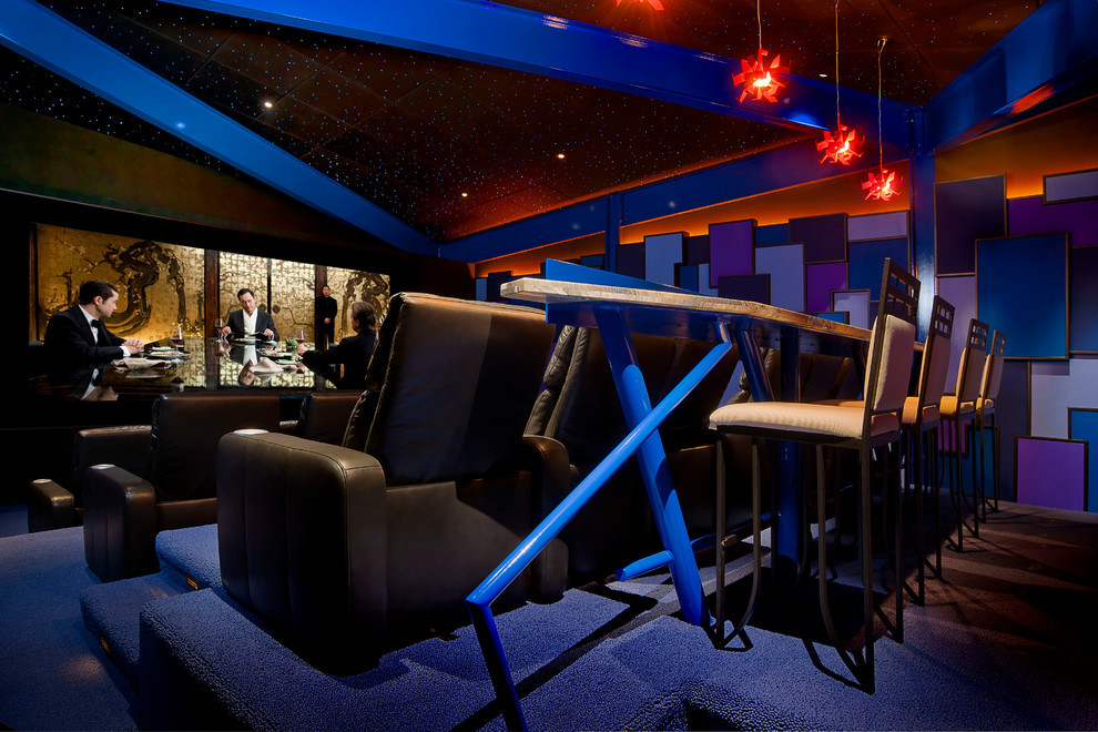 Photo of a contemporary enclosed home theatre in Cleveland with carpet and blue floor.