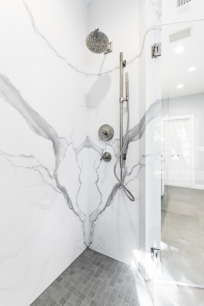 Inspiration for a mid-sized contemporary master bathroom in Dallas with white cabinets, a freestanding tub, an open shower, a one-piece toilet, white tile, stone slab, grey walls, an undermount sink, granite benchtops, grey floor, an open shower, white benchtops, an enclosed toilet and a double vanity.