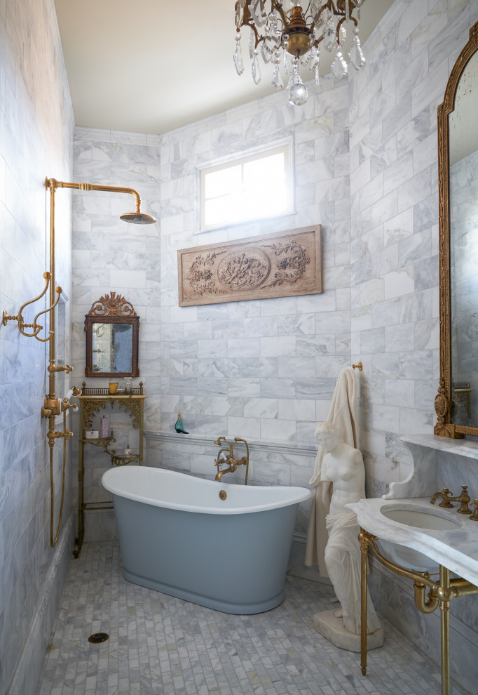 Inspiration for a traditional bathroom in New Orleans with a freestanding tub, white tile, mosaic tile floors, an undermount sink, grey floor and white benchtops.