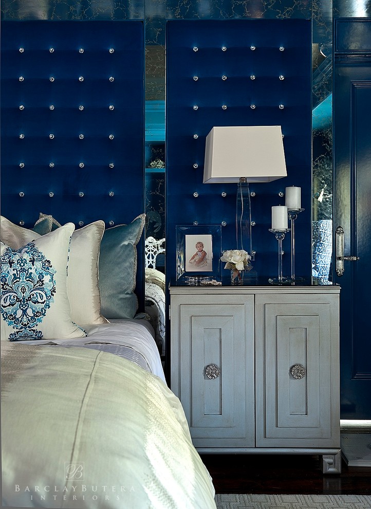 Eclectic master dark wood floor bedroom photo in Orange County with blue walls