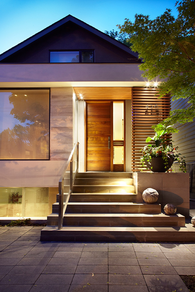 Inspiration for a transitional two-storey exterior in Toronto.