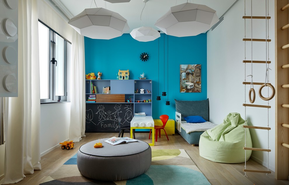 Inspiration for a contemporary kids' bedroom for kids 4-10 years old and boys in Moscow with light hardwood floors.