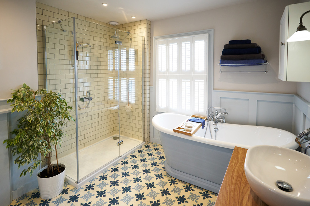 Wood panelled main bathroom with encaustic flooring and large shower