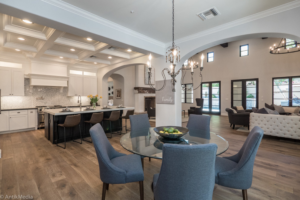 Design ideas for a large transitional open plan dining in Phoenix with grey walls, medium hardwood floors, no fireplace and brown floor.