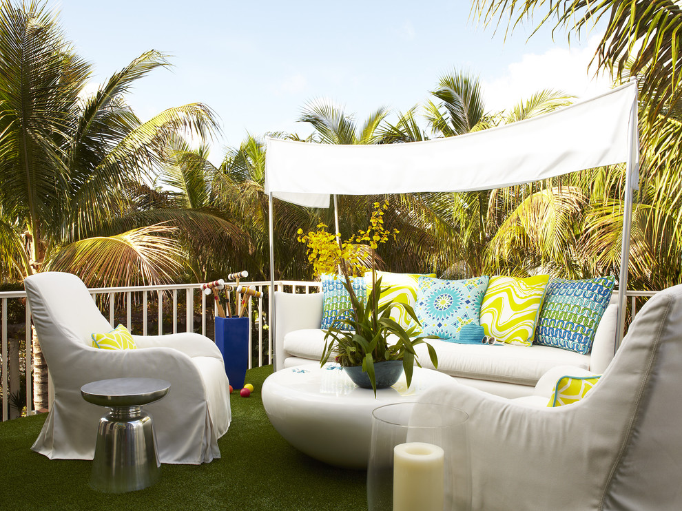 Photo of a large contemporary backyard deck in Miami with no cover.