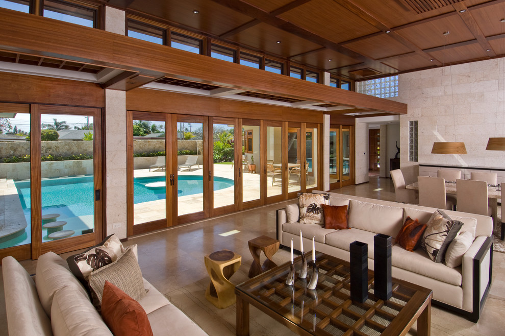 Mid-sized contemporary formal open concept living room in Hawaii with travertine floors.