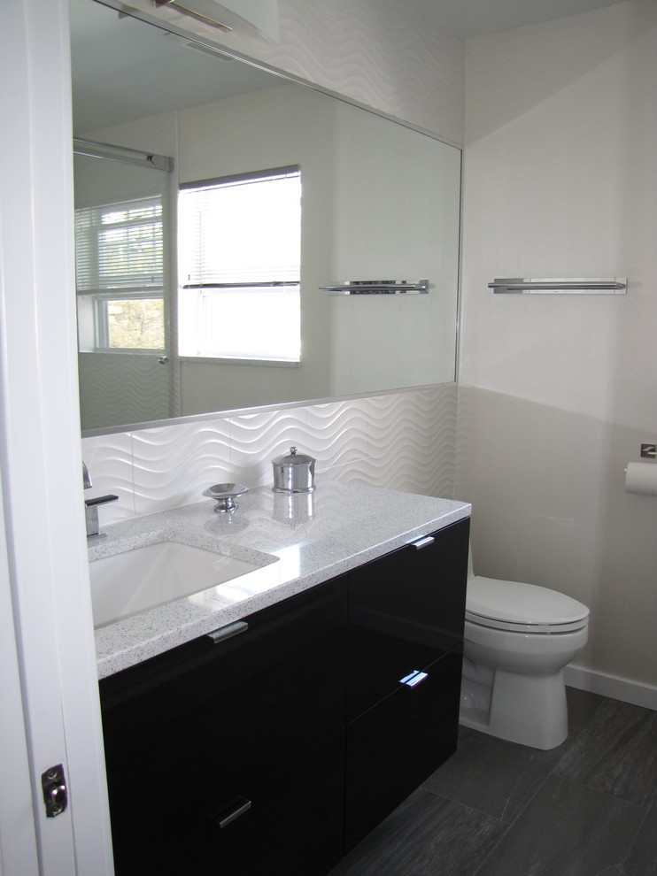 Design ideas for a modern bathroom in New York with an undermount sink, flat-panel cabinets, black cabinets, engineered quartz benchtops, an open shower, white tile and ceramic tile.