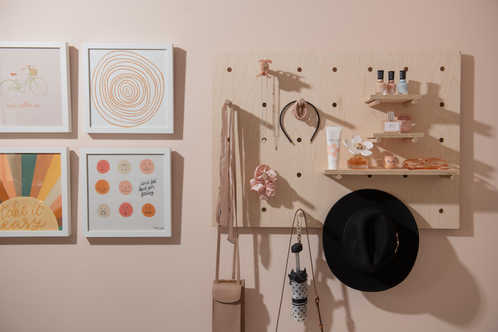 This is an example of a mid-sized scandinavian kids' bedroom for kids 4-10 years old and girls in Vancouver with orange walls, carpet and beige floor.