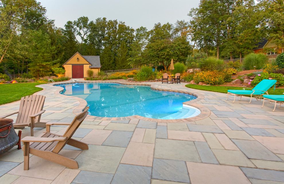 Inspiration for a mid-sized transitional backyard tile and kidney-shaped pool house remodel