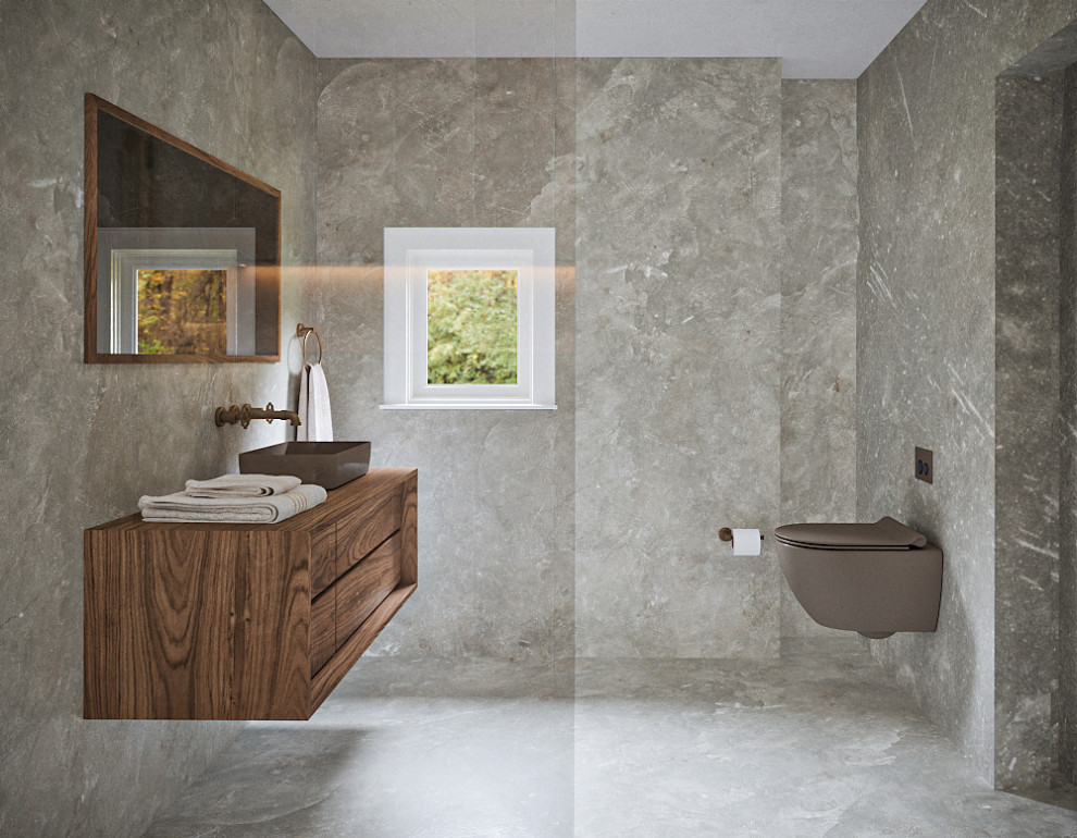 Exempel på ett mellanstort modernt brun brunt en-suite badrum, med luckor med infälld panel, skåp i mellenmörkt trä, en vägghängd toalettstol, grå väggar och träbänkskiva