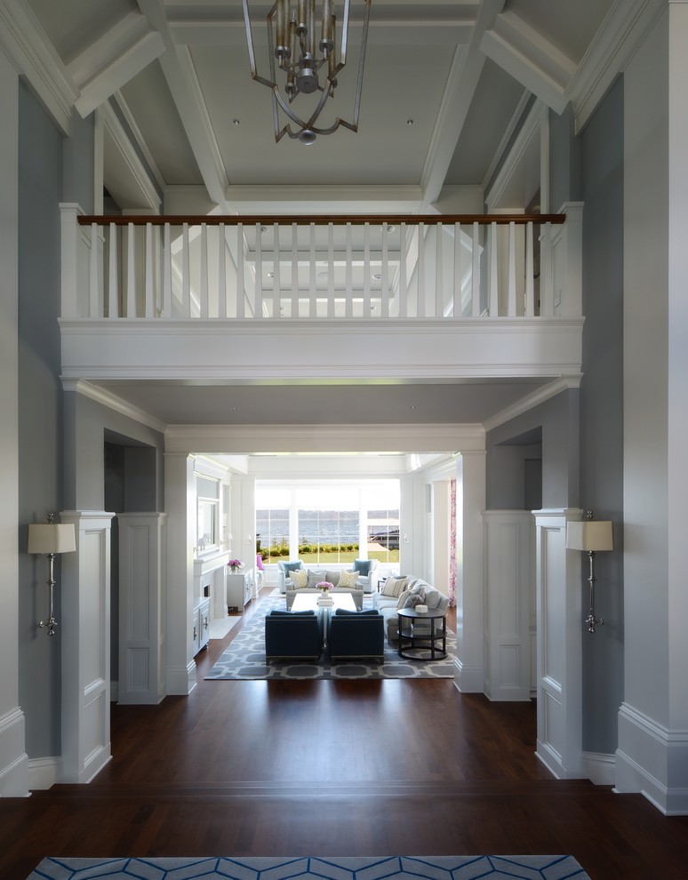 Design ideas for an expansive transitional foyer in Seattle with dark hardwood floors, grey walls, brown floor, a single front door and a white front door.