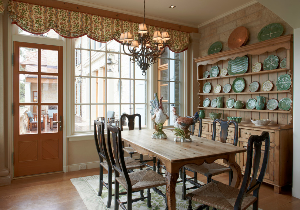 Inspiration for a country dining room in Chicago with medium hardwood floors.